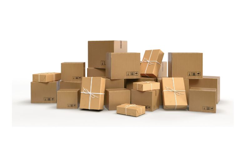 A stack of assorted cardboard boxes on a white background.